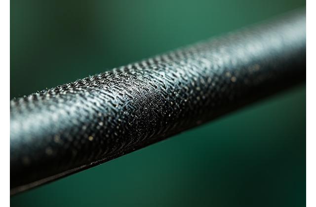 Close-up of carbon fiber weave in a fishing rod